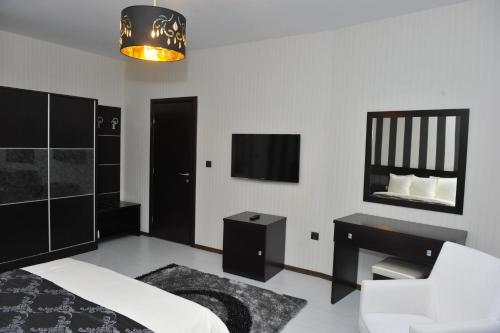Ένα ή περισσότερα κρεβάτια σε δωμάτιο στο Eros Motel
