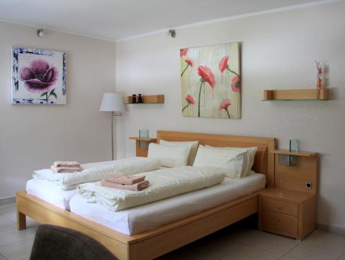 a bedroom with a bed with two pillows on it at Bed and Breakfast am Höhenweg in Warstein