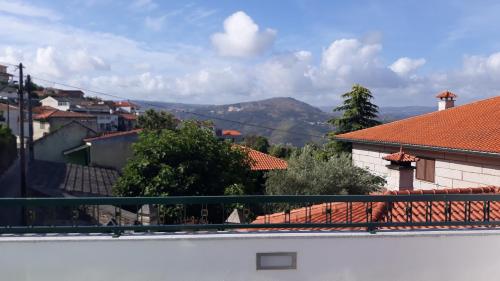 a view of a city from a balcony at Casa da Fonte in Peso da Régua