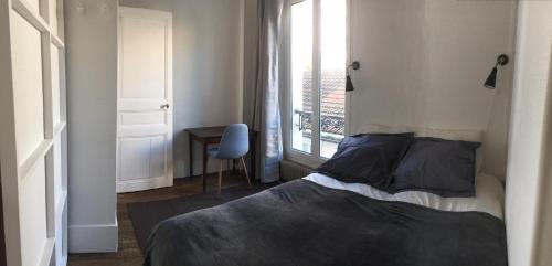 Кровать или кровати в номере Joli 2 pièces # Paris 14eme