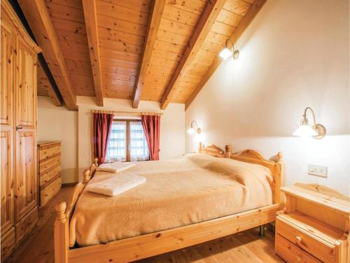 Łóżko lub łóżka w pokoju w obiekcie Agritur Al Paradis - Appartamenti