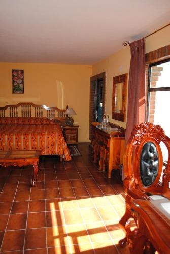 a bedroom with a bed and a sink at Hotel Boutique Posada la Casona de Cortés in Tlaxcala de Xicohténcatl