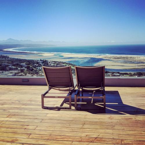 two chairs sitting on top of a roof at La Vista Lodge in Plettenberg Bay