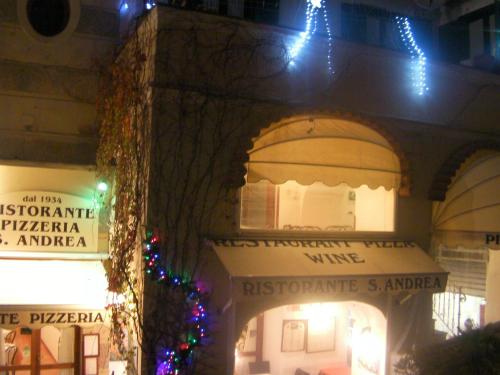 a building with christmas lights on the side of it at Albergo S. Andrea in Amalfi