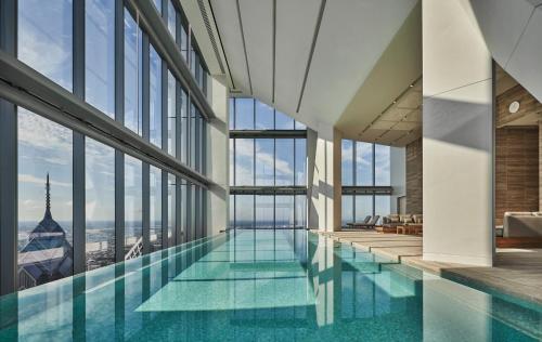 a large swimming pool in the middle of a building at Four Seasons Hotel Philadelphia at Comcast Center in Philadelphia