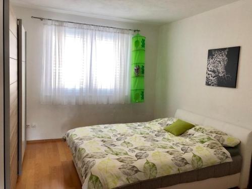 Ein Bett oder Betten in einem Zimmer der Unterkunft Apartmani Dujmovic