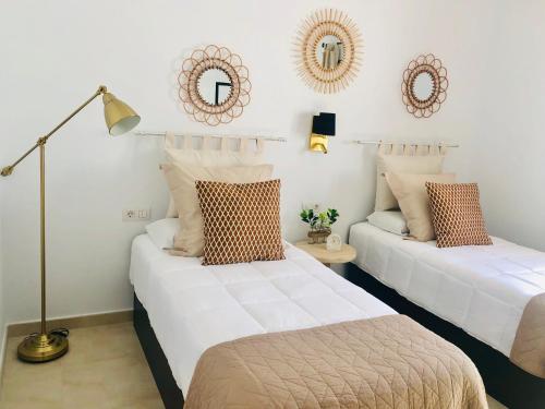 Posteľ alebo postele v izbe v ubytovaní Canaryislandshost l My Nest