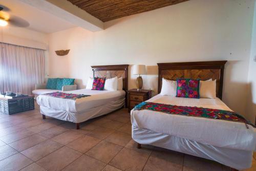 Postel nebo postele na pokoji v ubytování Casa de los Sueños Hotel Boutique