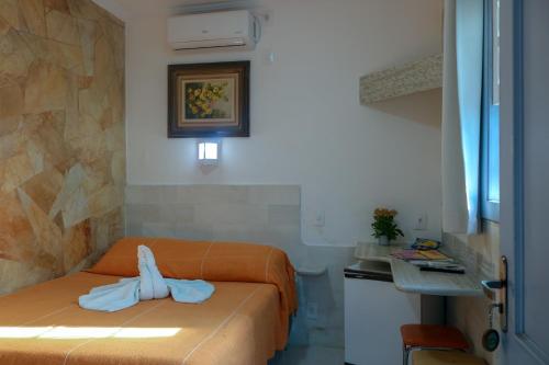 Ένα ή περισσότερα κρεβάτια σε δωμάτιο στο Pousada Arco-Íris