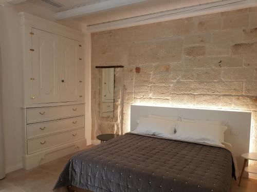 Postel nebo postele na pokoji v ubytování La Porta Vecchia Home