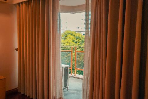 A balcony or terrace at City Garden Suites