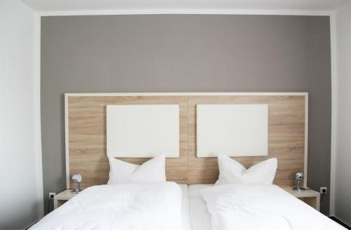 Postel nebo postele na pokoji v ubytování Stadthotel Alsfeld