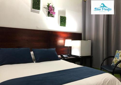 Postel nebo postele na pokoji v ubytování Hostal Blue Pacific