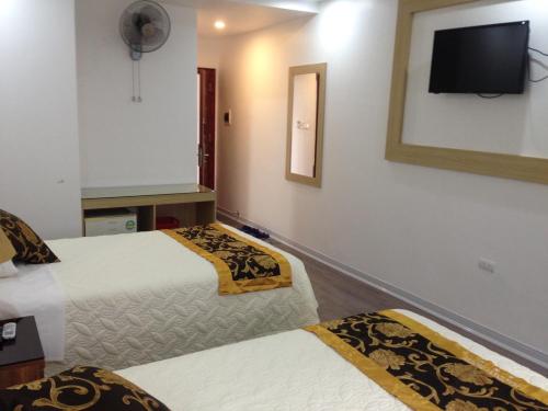 Cama o camas de una habitación en Hacinco Hotel