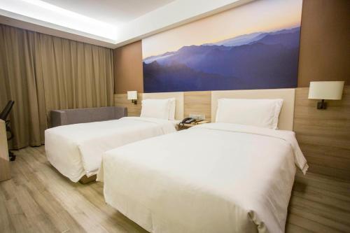 Atour Hotel Xi'an (Wenjing Road, North 2nd Ring Roadにあるベッド