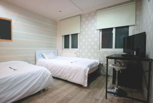Ένα ή περισσότερα κρεβάτια σε δωμάτιο στο Hostel Korea - Original