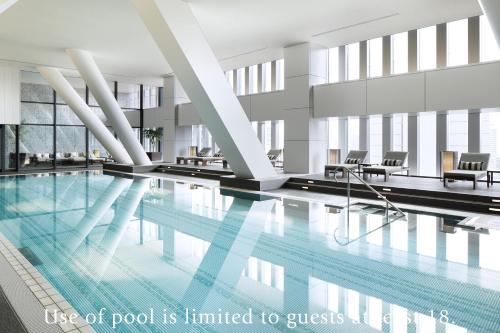 a pool is limited to guests in a building at The Capitol Hotel Tokyu in Tokyo