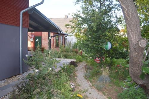 a garden in front of a house at Das Nest in Eisenstadt