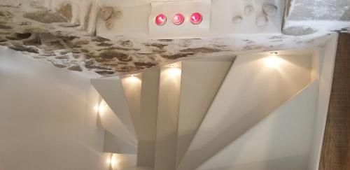 a room with a white counter with lights on it at Amaranti House n Art in Mandrakion