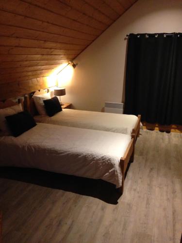 a bedroom with a large bed in a room at Les Balcons de Vaujany in Vaujany