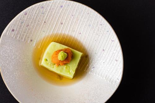 a white plate with a piece of food on it at Izu Mitohama Shotokan in Numazu