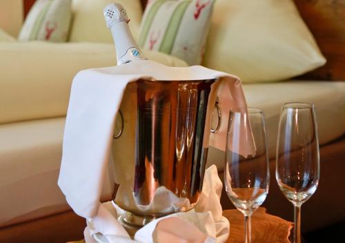 a blender with wine glasses on a table at Schmelmer Hof Hotel & Resort in Bad Aibling