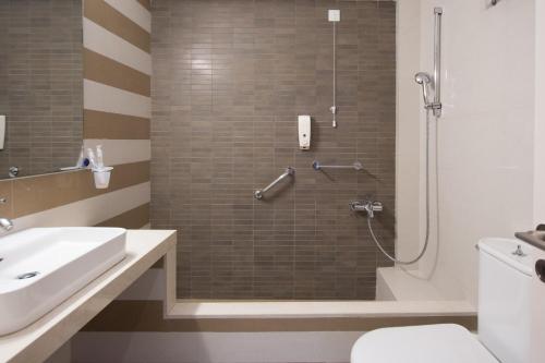 a bathroom with a shower with a toilet and a sink at Dali in Zakynthos