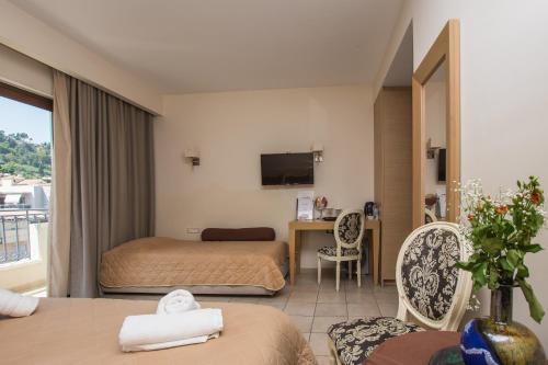 a hotel room with a bed and a desk at Dali in Zakynthos