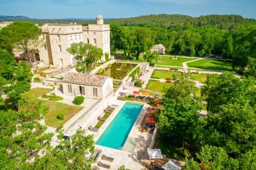 an aerial view of a mansion with a swimming pool at Château de Pondres in Villevieille