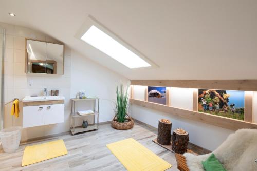 a living room with a skylight in the ceiling at Haus Thomas in Alpbach