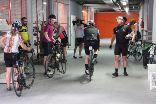a group of people riding bikes in a garage at Aparthotel Duva & Spa in Port de Pollensa