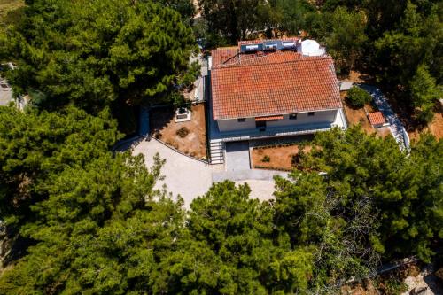 an overhead view of a house with a red roof at Ktima Fabiatos in Skala