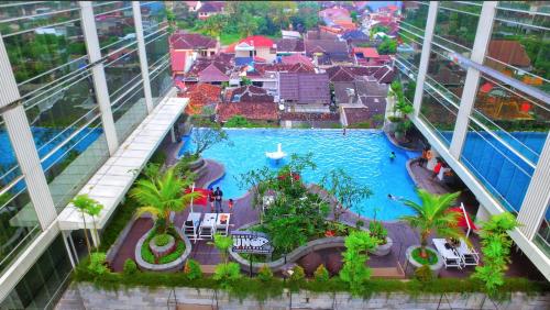 an aerial view of a pool in a building at Lavenderbnb Room 10 at Mataram City Apartment in Yogyakarta