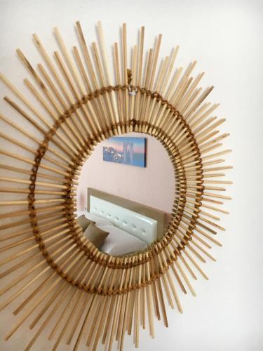 a large gold mirror with a table in front of it at Ria mare in Qeparo