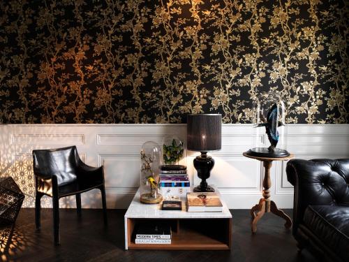 a living room with a couch and a table at City B&B Villa Nicola in Amsterdam