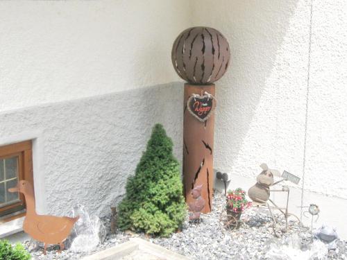 a model of a house with a cactus and a fence at Ferienwohnung Wagner in Isny im Allgäu