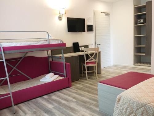 Postel nebo postele na pokoji v ubytování Alma Living Hotel- Al Girarrosto