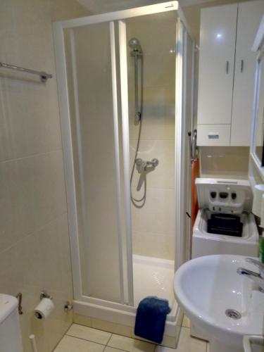 a bathroom with a shower and a sink at Dunatlantico in Playa del Ingles