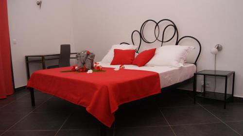Postelja oz. postelje v sobi nastanitve Au Petit Baobab