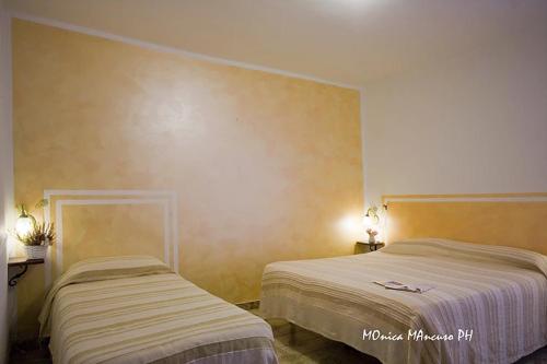 Postel nebo postele na pokoji v ubytování B&B La Reggia
