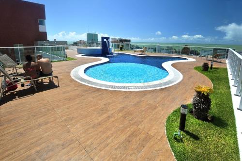 a swimming pool on the roof of a building at Elza's Appartament in João Pessoa