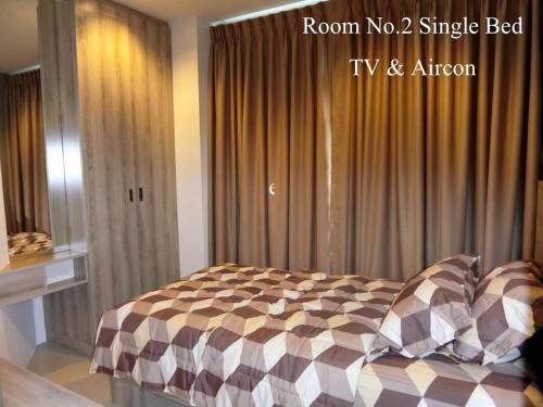 Postel nebo postele na pokoji v ubytování Grand Blue Condominium 509 Mea Phim Beach, Klaeng, Rayong, Thailand