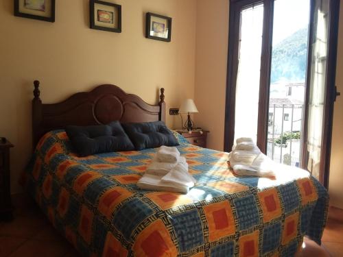 Ένα ή περισσότερα κρεβάτια σε δωμάτιο στο Vivelorural casa Tassone, Grazalema - Cádiz