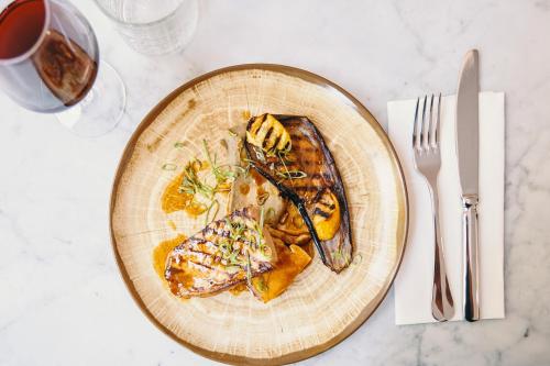 a plate of food on a table with a fork and knife at Mercure Marseille Canebière Vieux-Port in Marseille