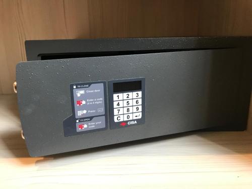 a microwave oven sitting on top of a table at Caring Hotel in London