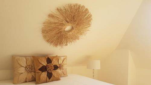 a room with a bed with a fan on the ceiling at Appartement sympa à 5 min du centre ville à pied in Charleville-Mézières