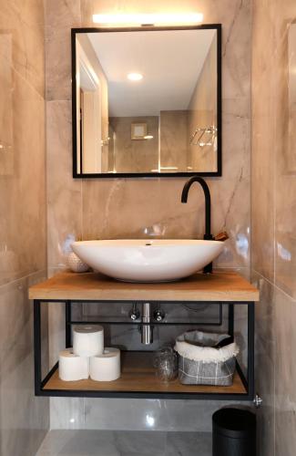 a bathroom with a sink and a mirror at Villa Teuta in Trogir