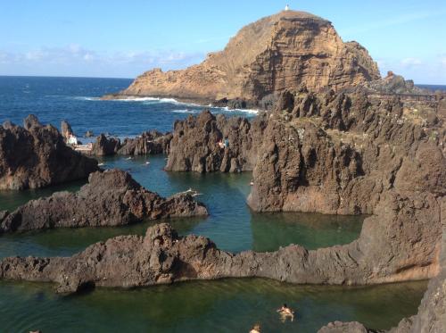 a view of a rocky island in the ocean at Pensão Fernandes in Porto Moniz