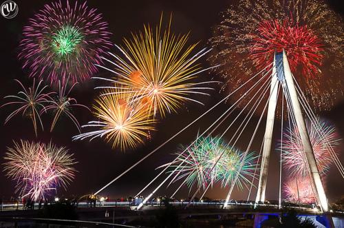 a group of fireworks exploding in the sky at night at The Bold Hotel; BW Signature Collection in Southport