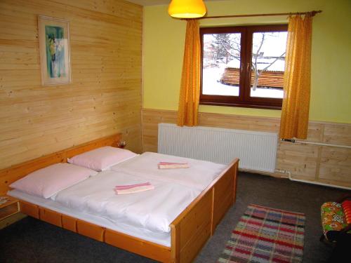 Ένα ή περισσότερα κρεβάτια σε δωμάτιο στο Chalupa Vysoke Tatry